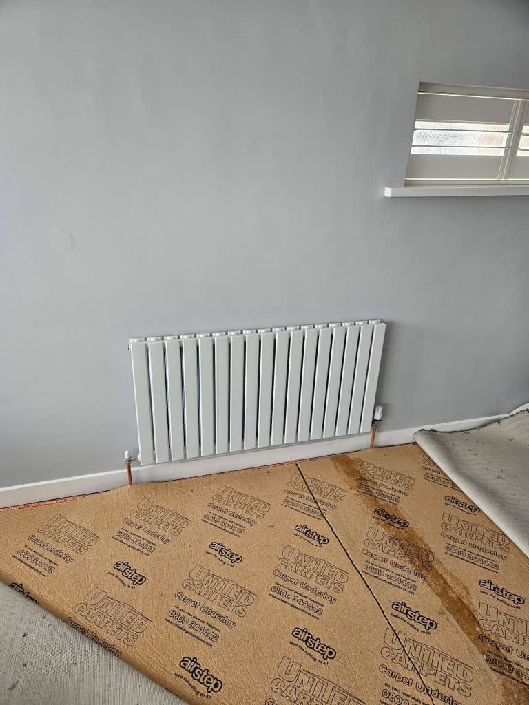 White column radiator with copper pipework