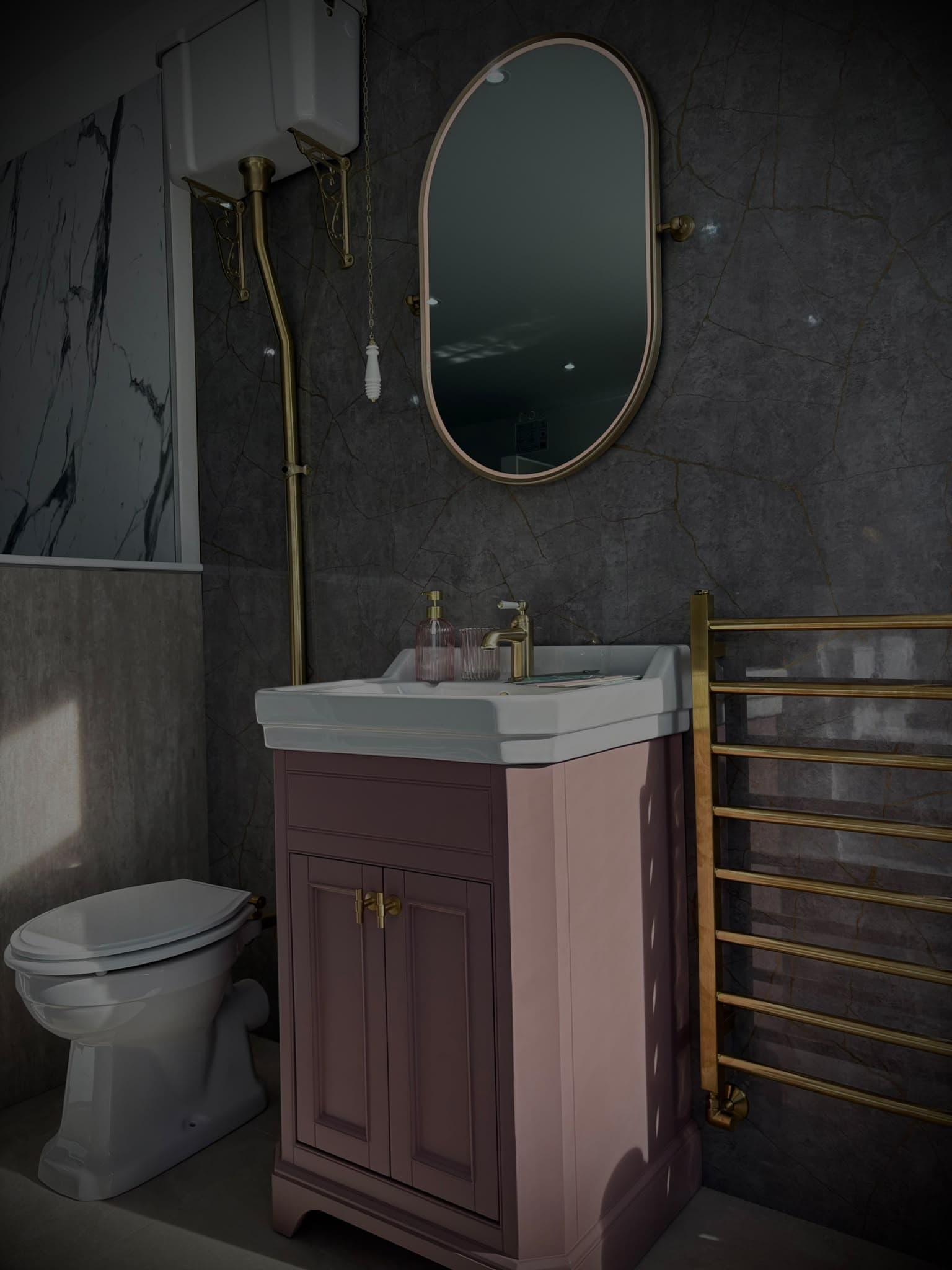 Traditional bathroom display with pink vanity, high-level cistern toilet and brass towel rail