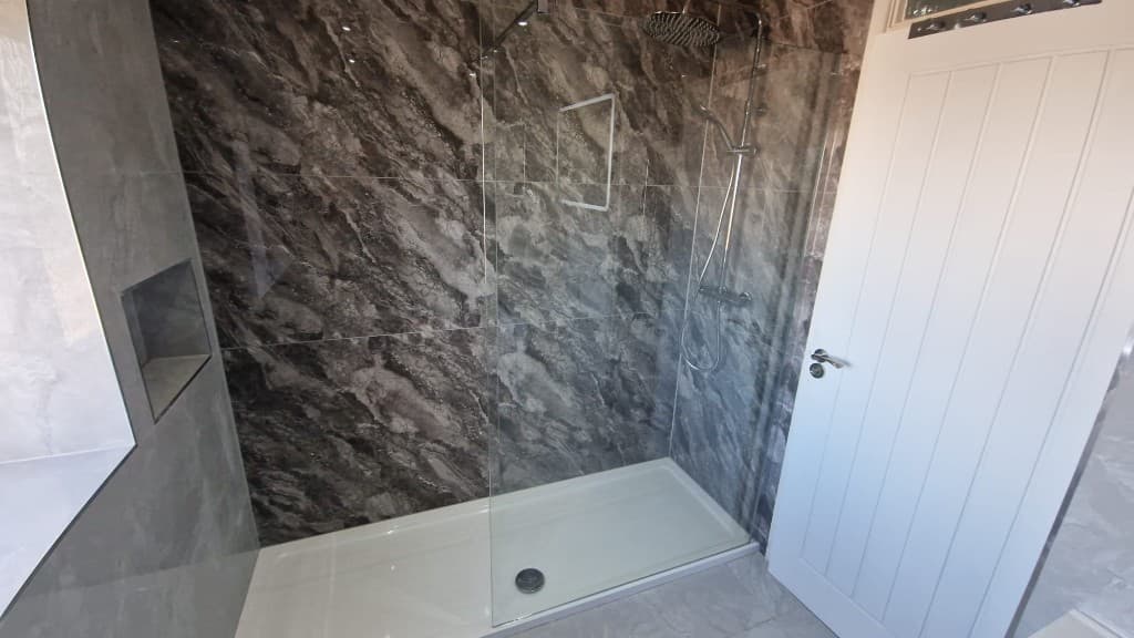 Luxury bathroom refurbishment with large-format tiled shower area