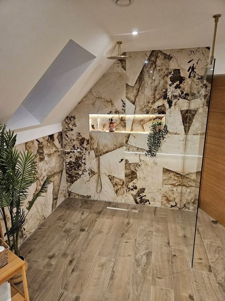 Premium stone-tile shower with gold rainfall head
