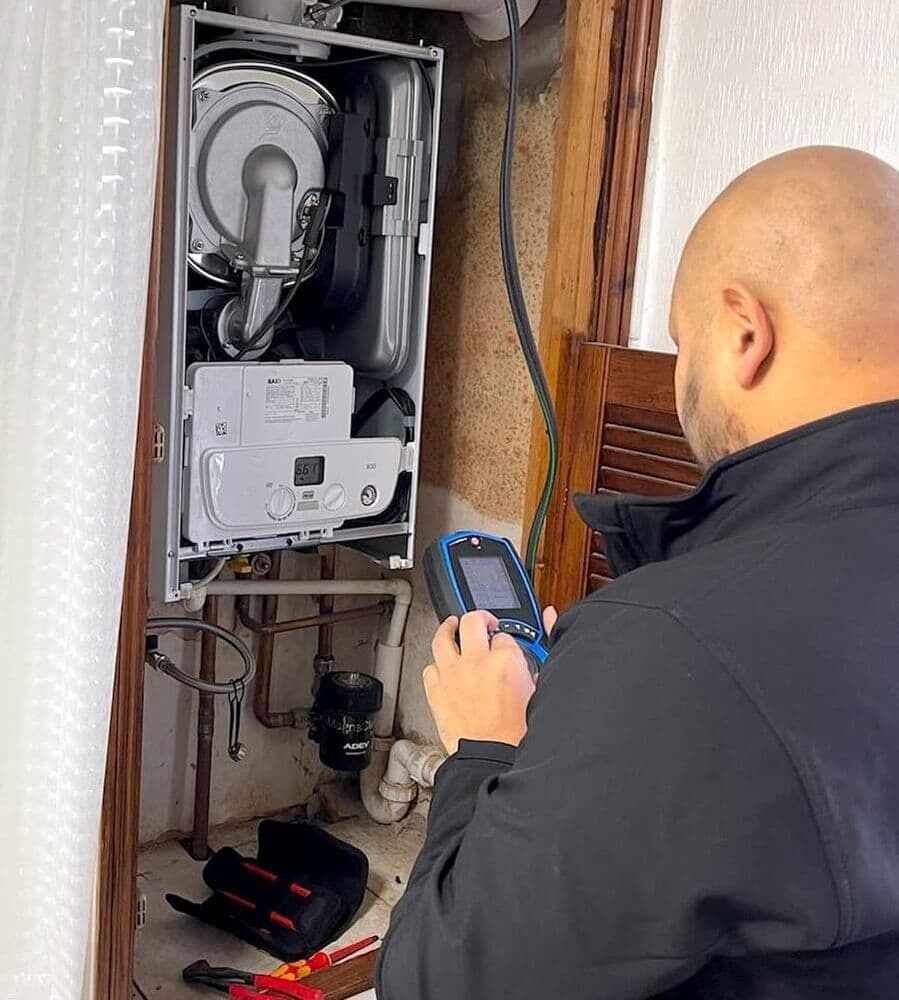 Gas Safe engineer servicing boiler in South Yorkshire home